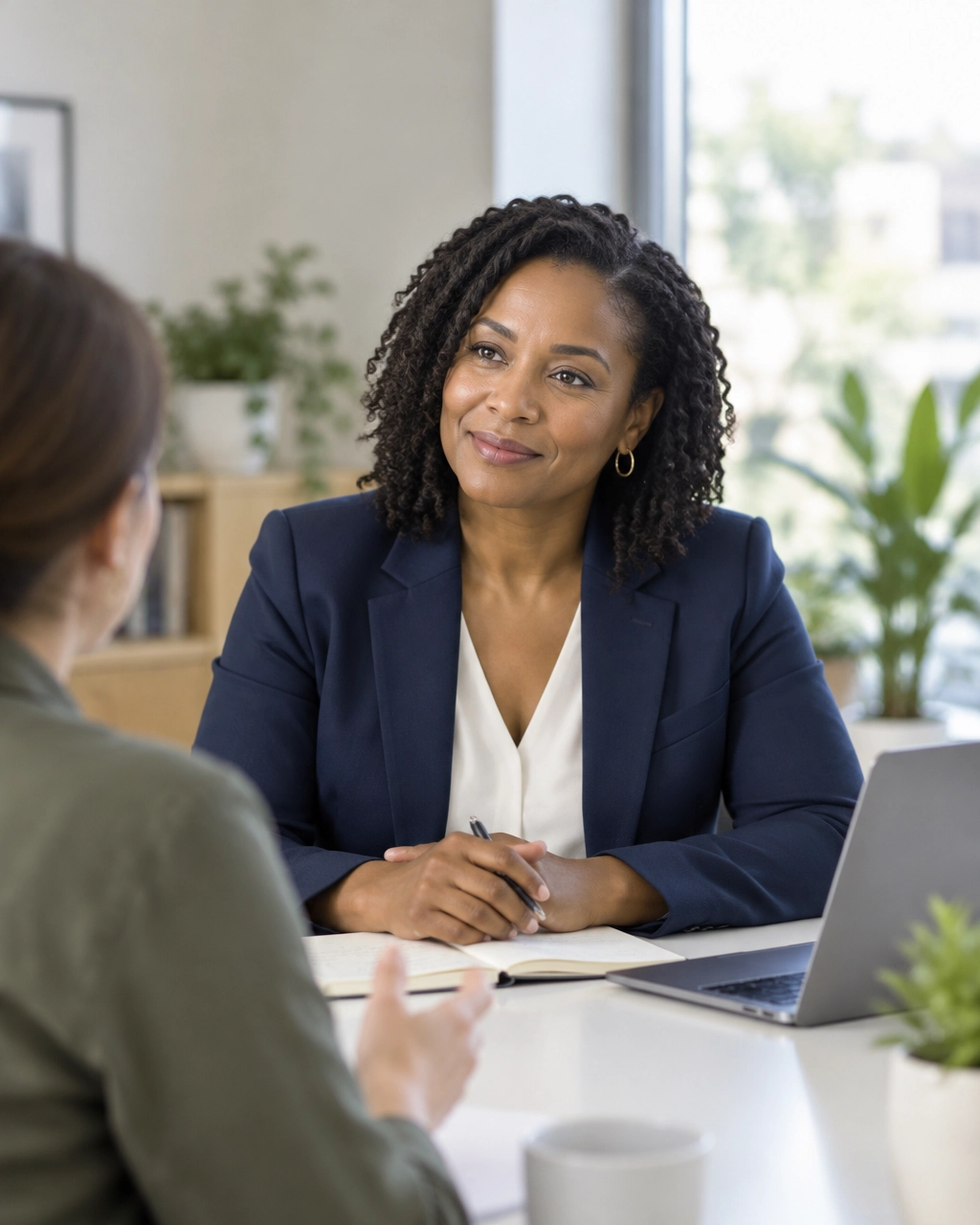 HR consultant meeting with a small-business owner at a table